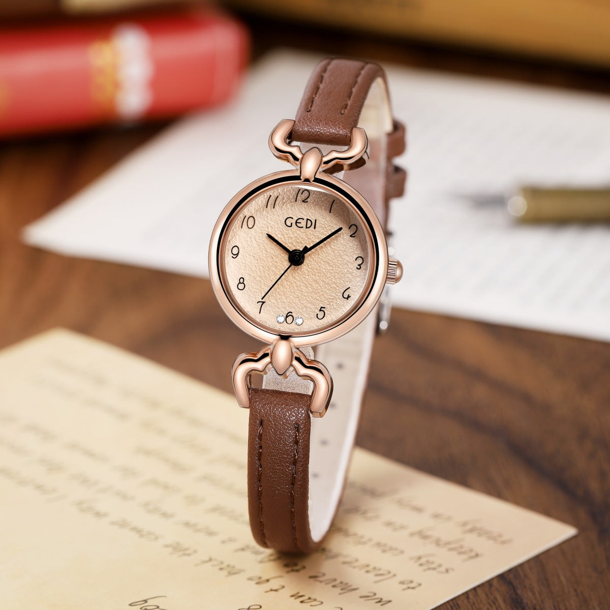 Petite ladies quartz watch with brown leather strap and rose-gold round case