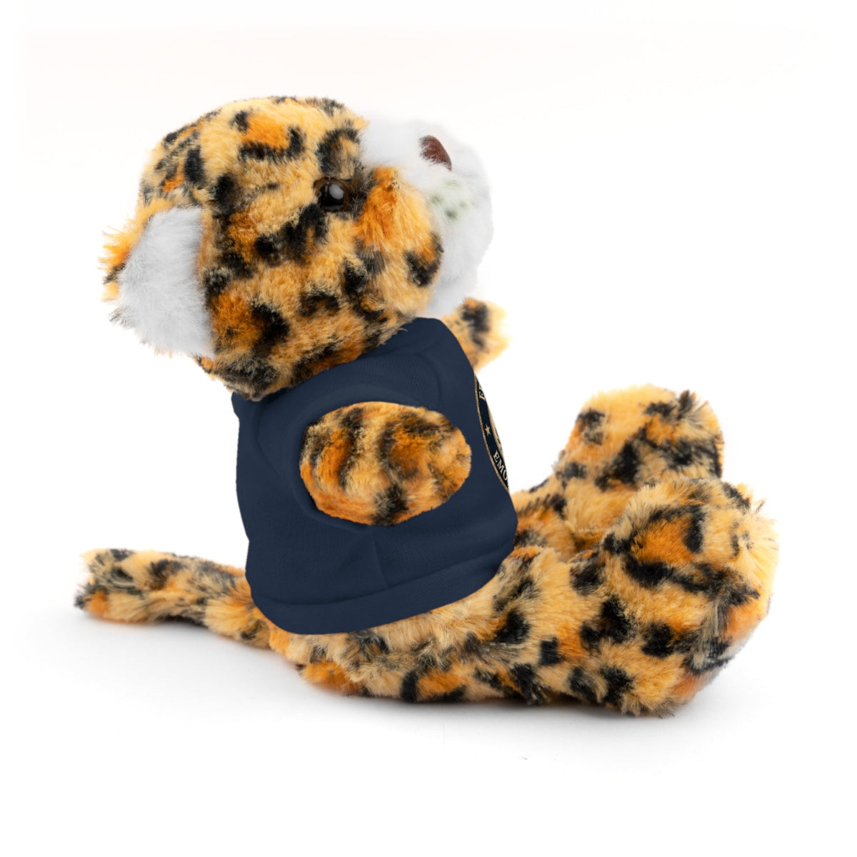 Jaguar plush cat with navy T-shirt and round emblem, side-lying with head turned