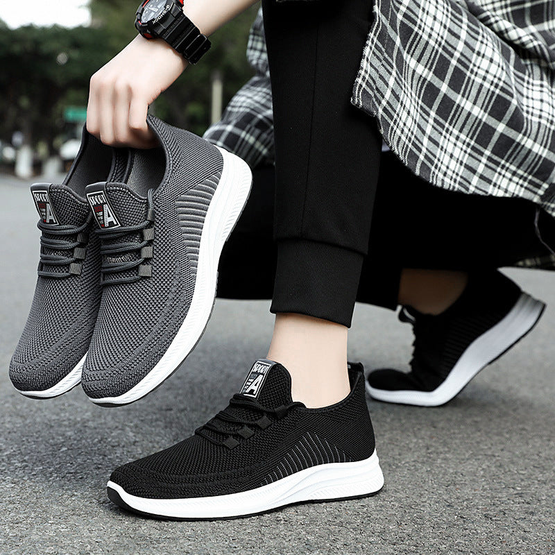 Black mesh sneakers with elastic knit texture and white sole