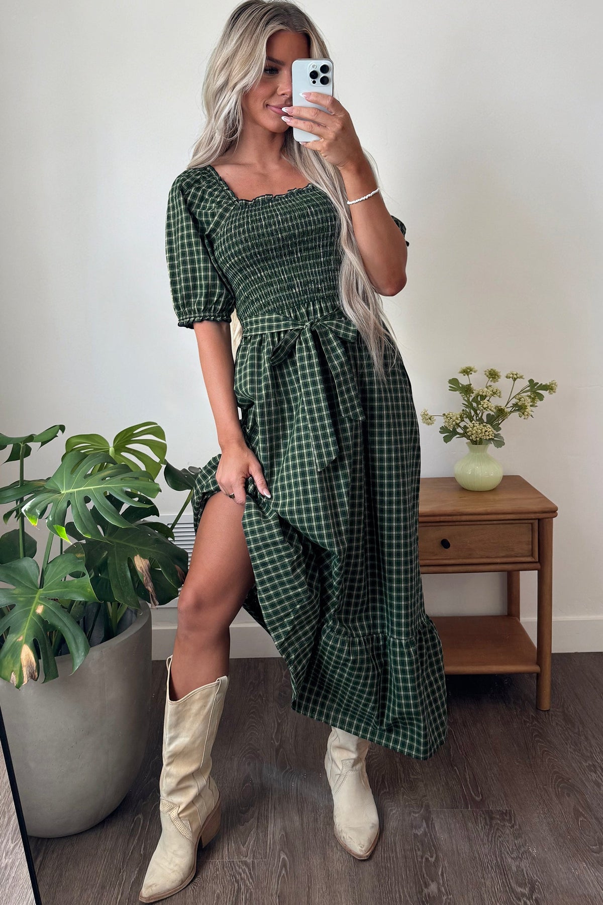 Dark green plaid square-neck dress with shirred waist, puff sleeves, and ruffle hem.