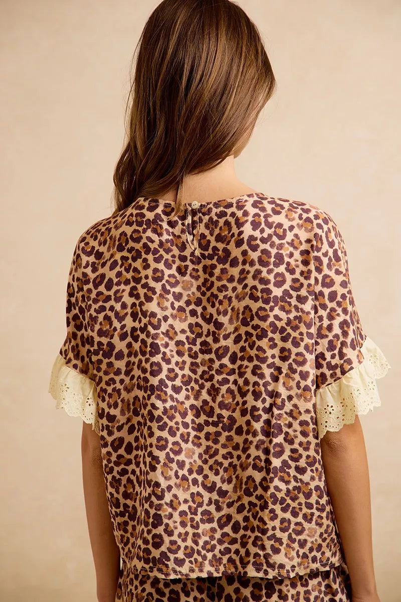 Leopard print ruffled top with eyelet lace sleeve ruffles and matching shorts, back view