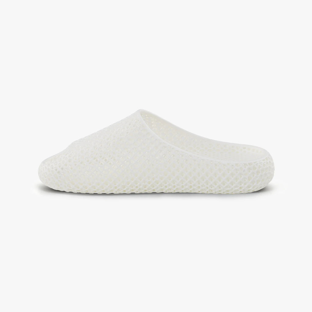 White 3D-printed mesh slip-on slipper with low-profile sole and tapered toe.