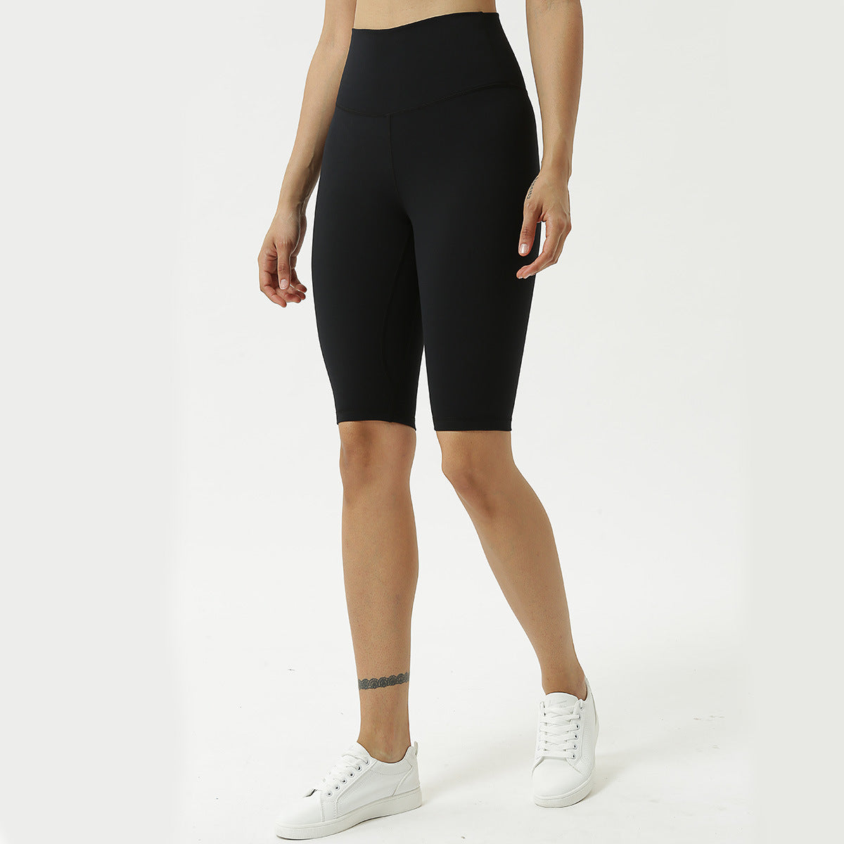 High-waist black yoga capri pants, full front view