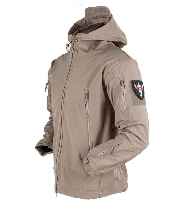 Three-in-one all-weather shell jacket, tan with hood, zip front, utility pockets.