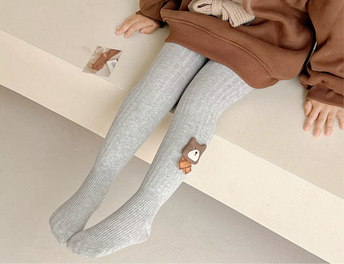 Gray fleece-lined ribbed footed leggings for toddlers, with small bear patch on ankle