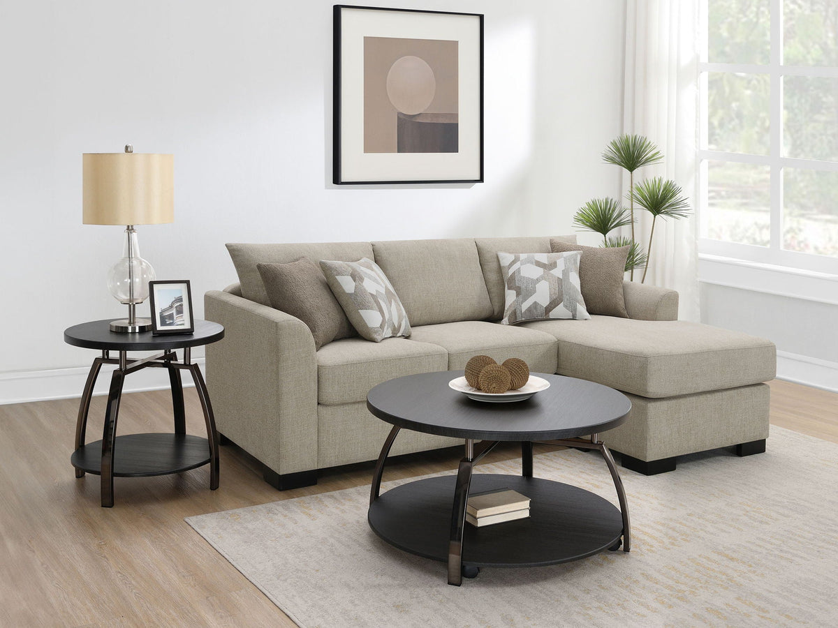 Camel upholstered sleeper sectional chaise sofa with extended white mattress and dark metal platform.