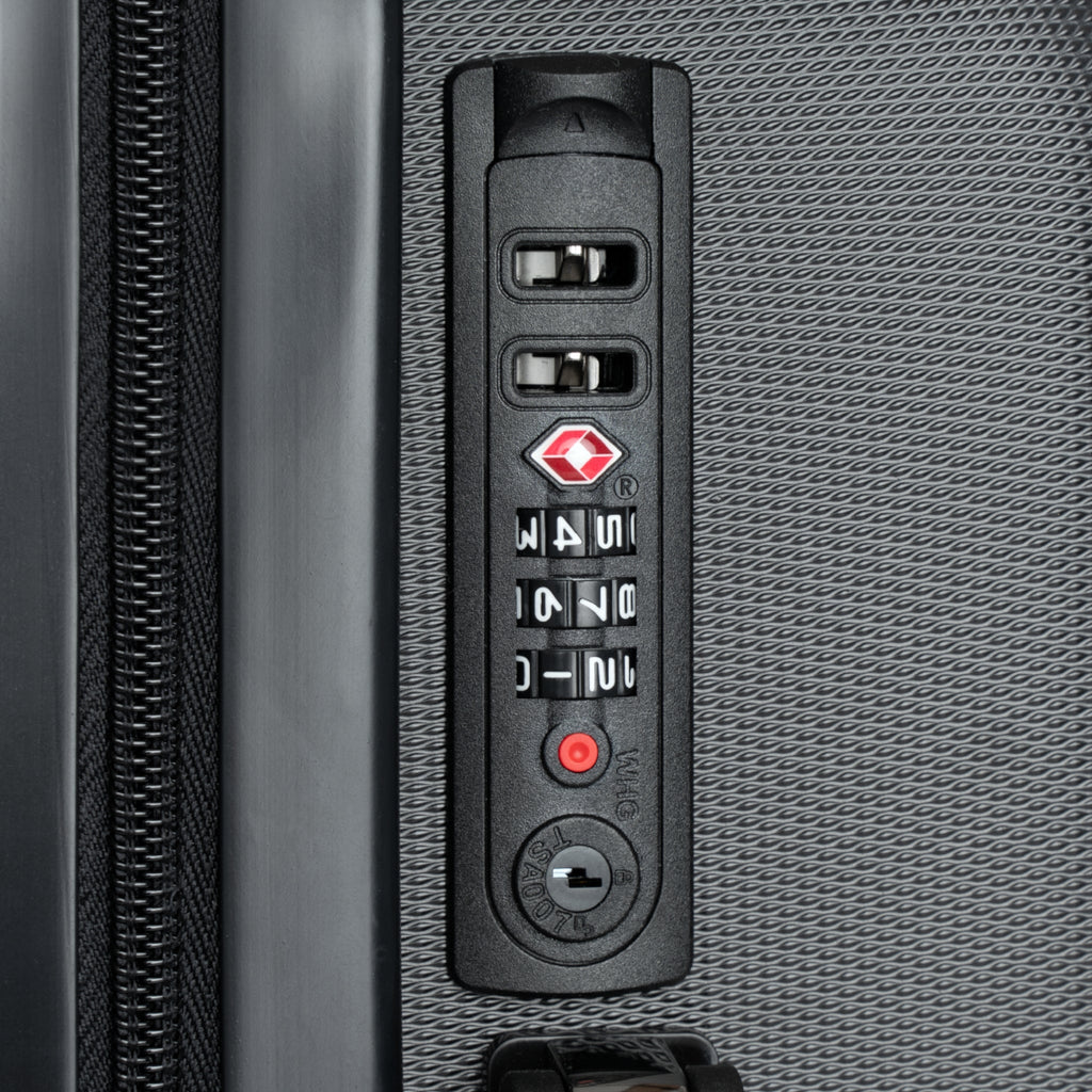 Hard-shell suitcase control panel, textured side with numeric lock keypad