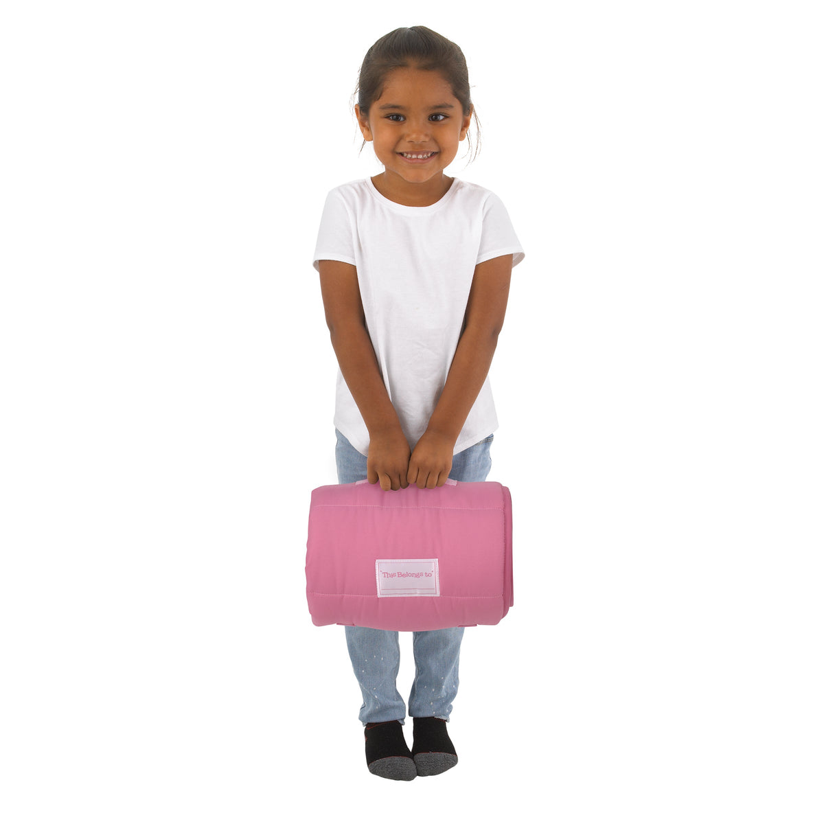 Toddler nap mat in pink carried by a child with front flap and name label