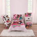 Toddler bed set with pink princess comforter, fitted sheet, top sheet, and pillowcase