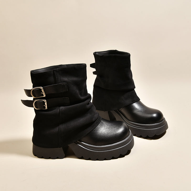 Black platform combat ankle boots with buckled straps and thick lug platform sole.