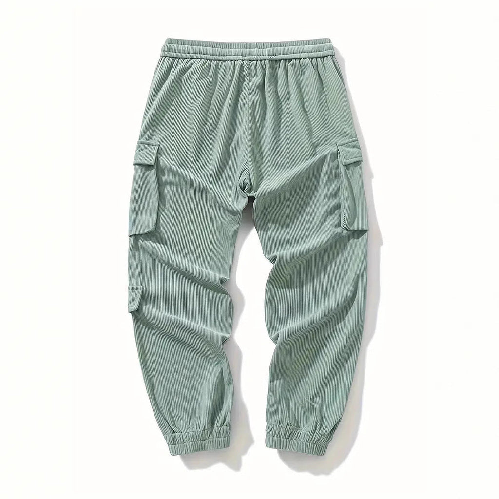 Light green corduroy cargo pants with side pockets and ankle tightening cuffs