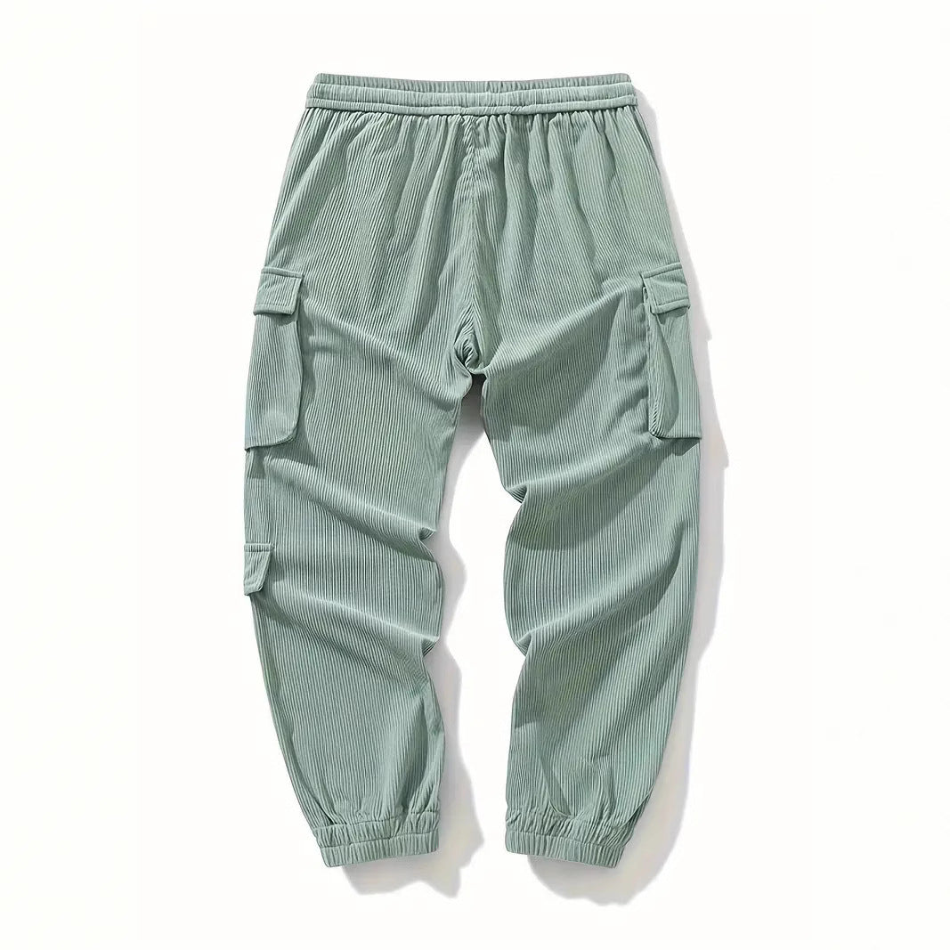 Light green corduroy cargo pants with side pockets and ankle tightening cuffs