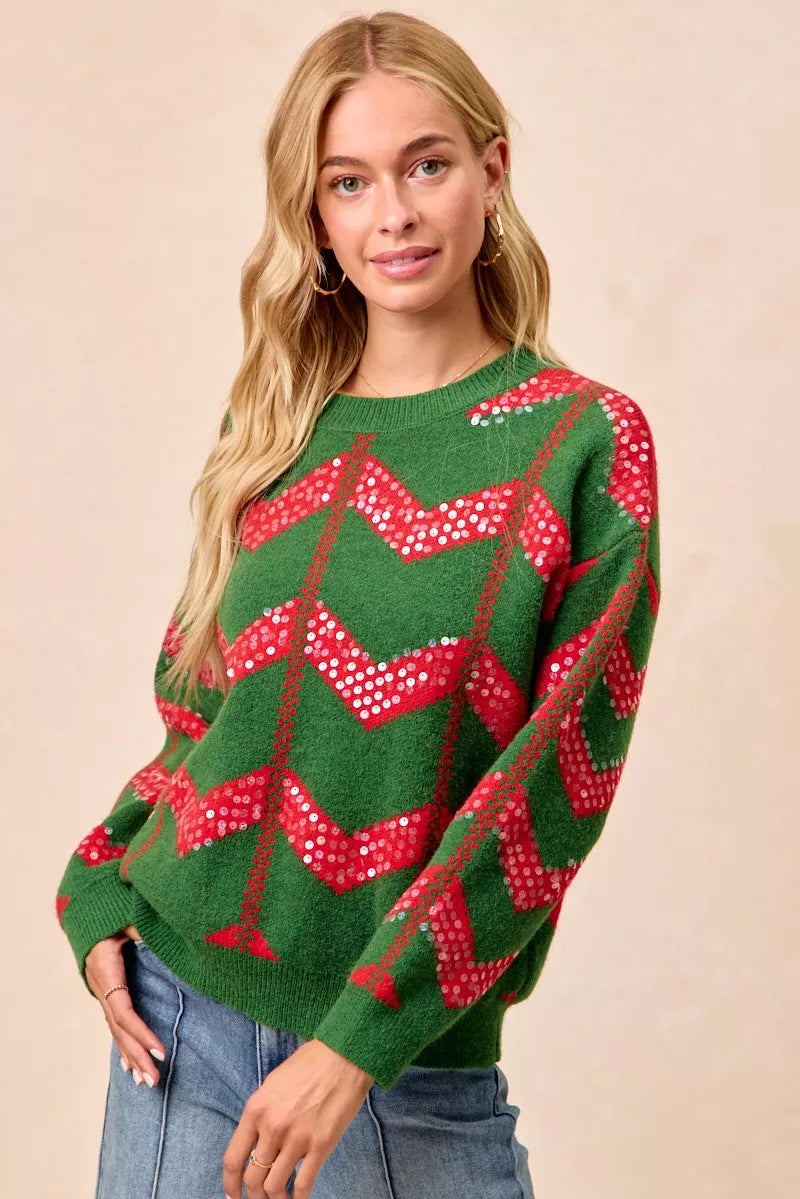 Green chevron knit sweater with red sequin zigzag design, front view