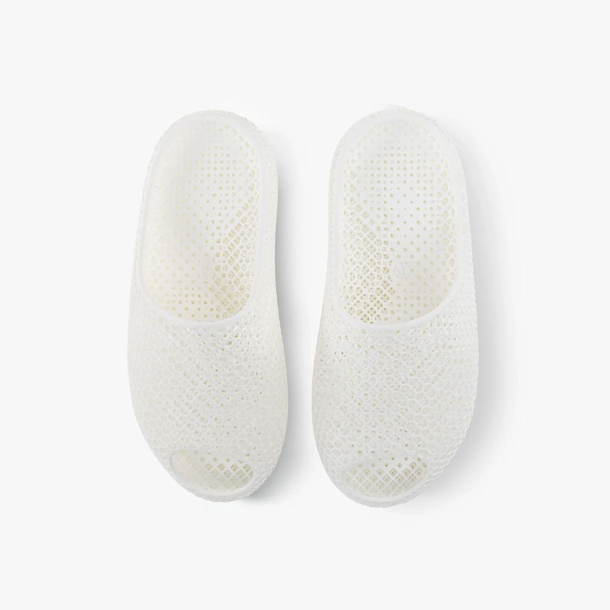 White 3D-printed mesh slippers, pair showing side openings and oval heel shape.