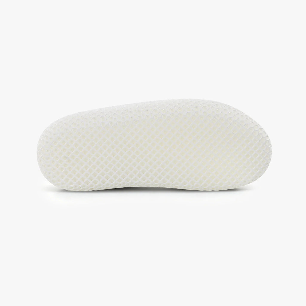 White 3D-printed mesh slipper, side profile with closed back and rounded base.