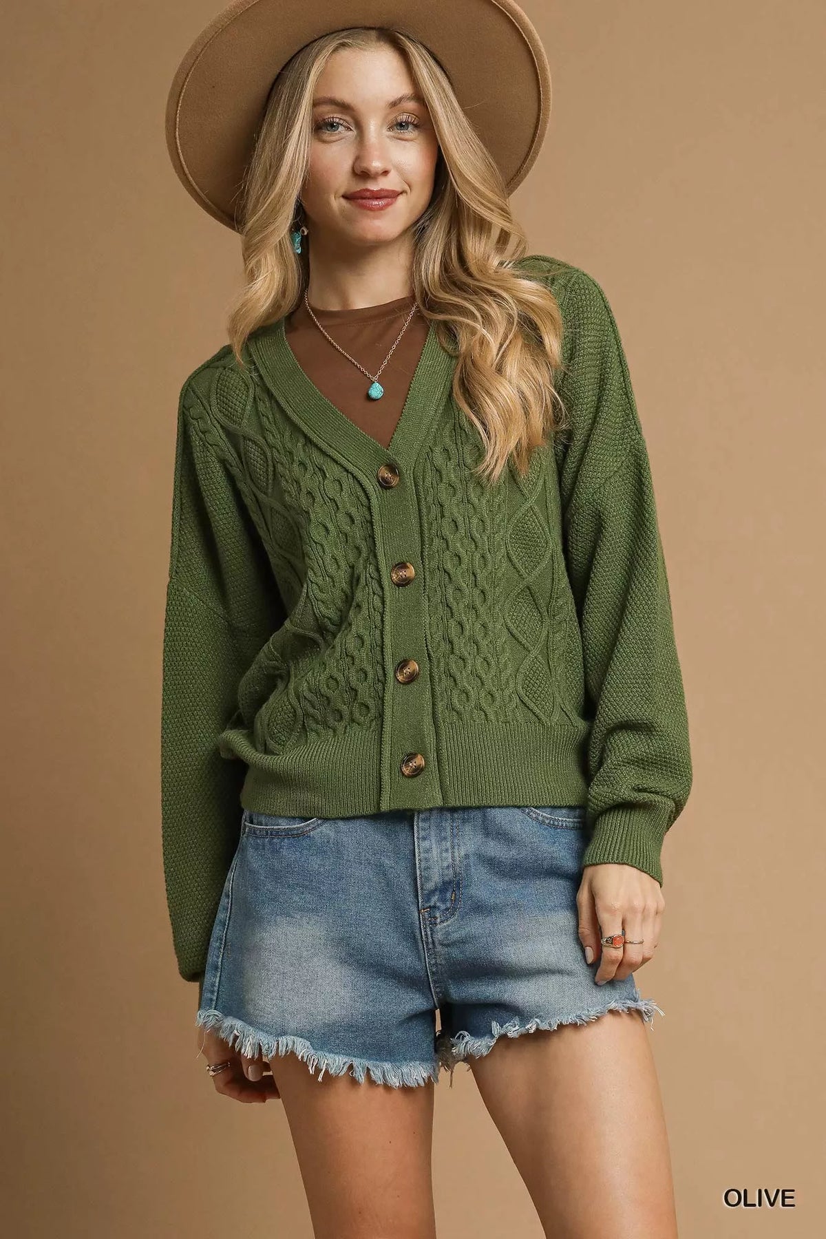 Olive cable-knit V-neck button-up cardigan with chunky knit texture.