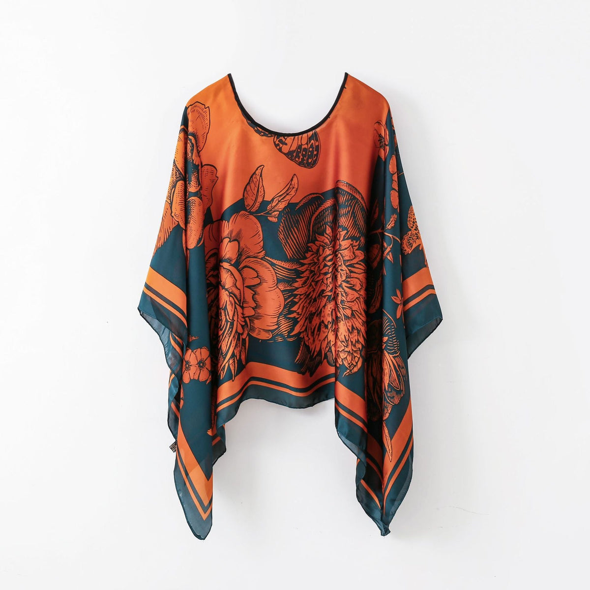 Orange and teal floral wrap poncho shawl with fringe hem and round neckline