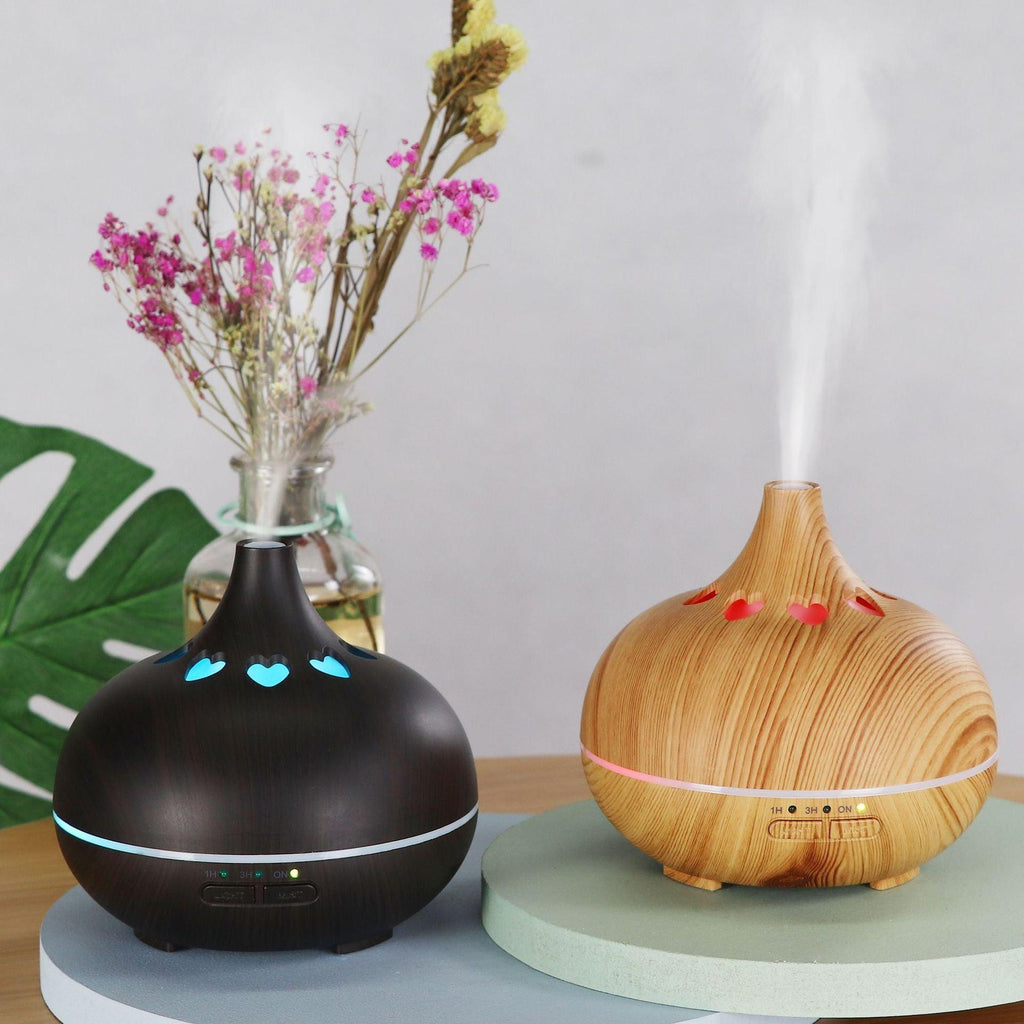 Wood-grain aromatherapy diffuser with glowing blue heart LED mist light