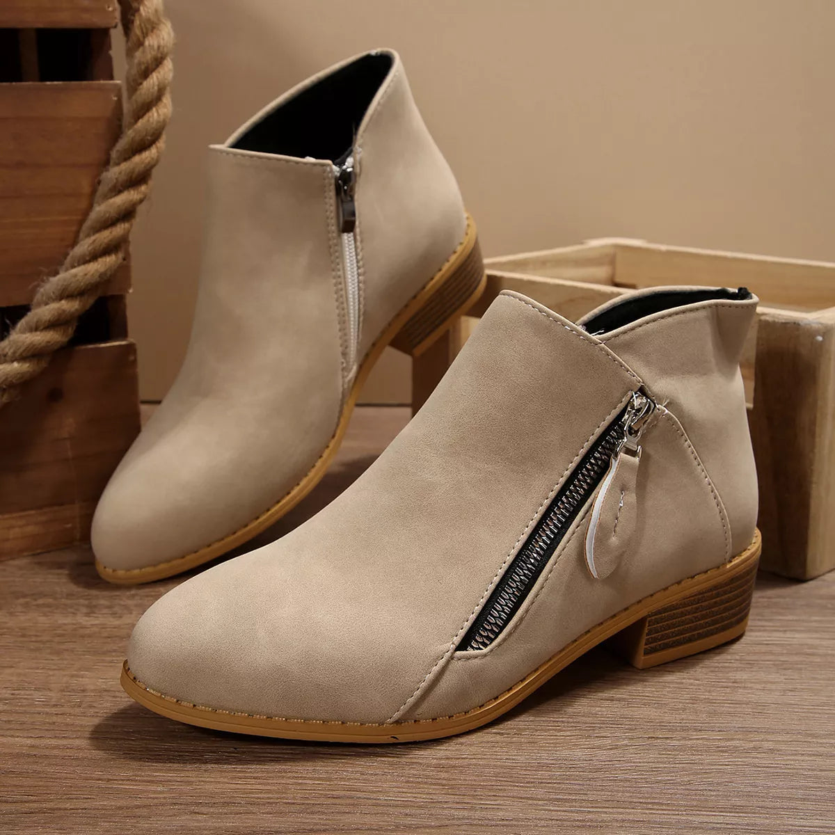 White suede block-heel ankle boots with side zipper and stitched toe cap