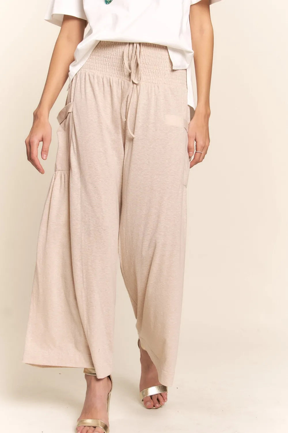 Light beige boho wide-leg pants with smocked waistband and side pockets