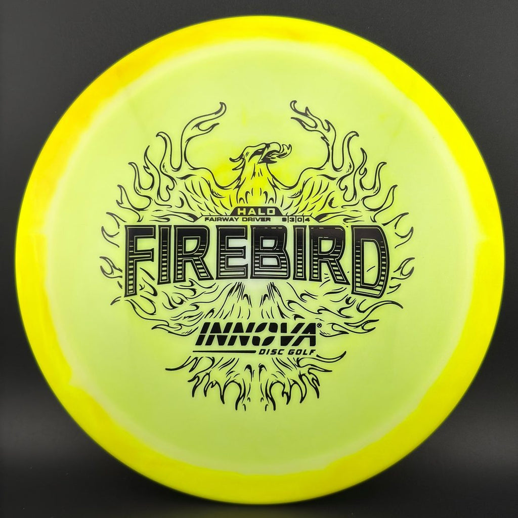 Disc golf driver with neon chartreuse face and dark “Firebird” graphic