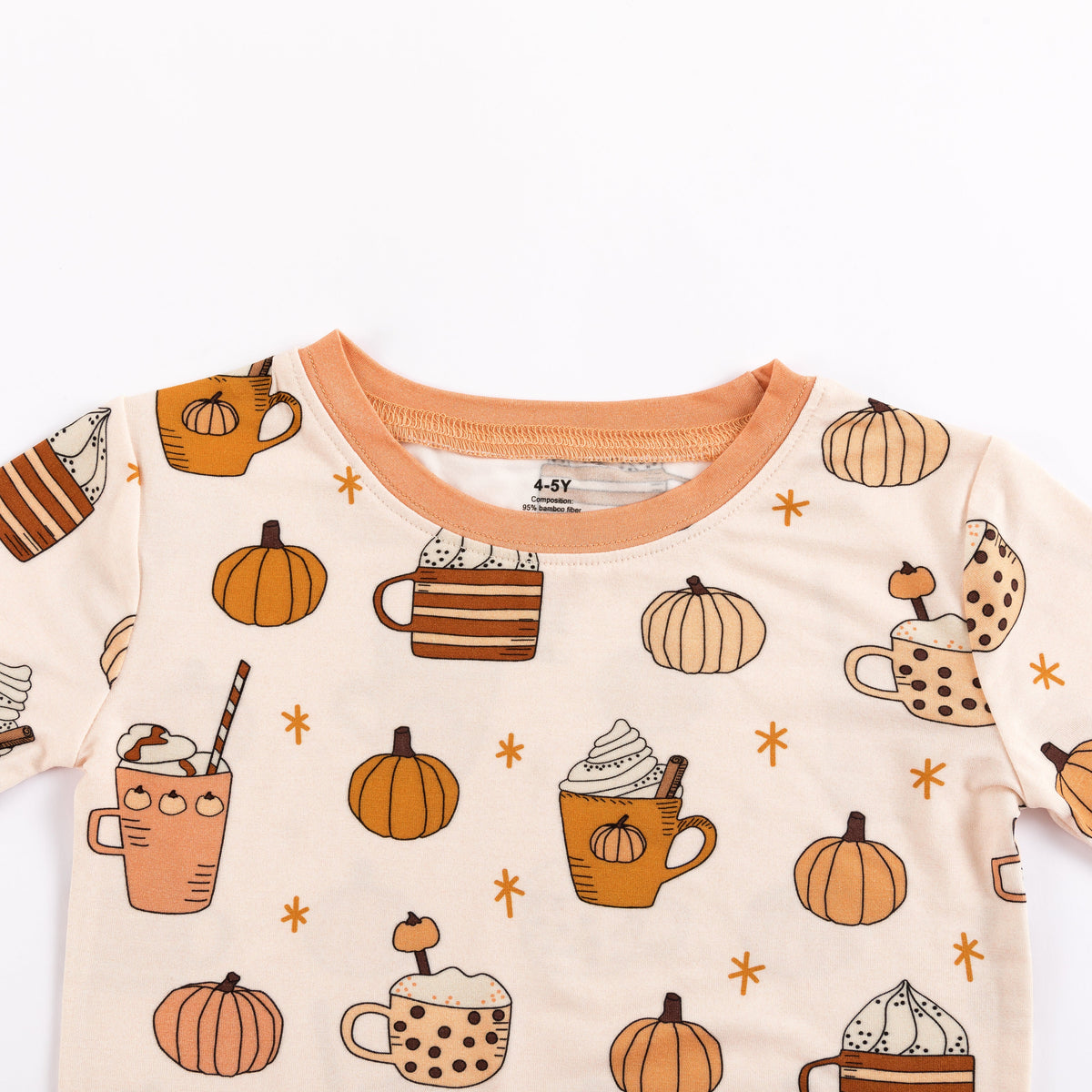 Cream long-sleeve pajama shirt with orange crew neck and pumpkin-spice graphics