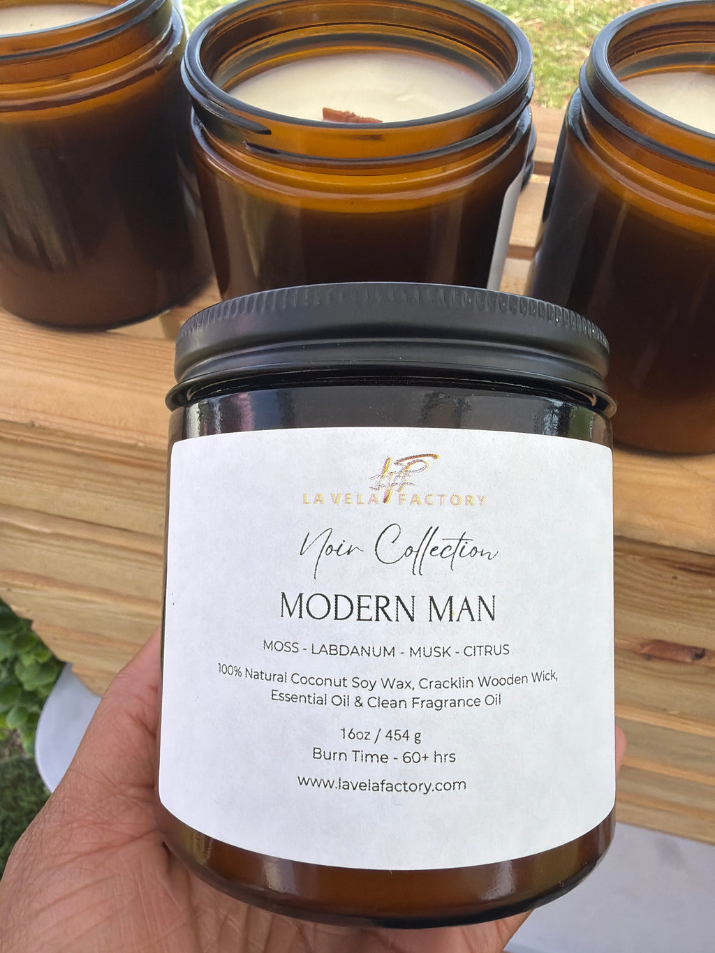 Amber glass jar candle with black lid, label for “Modern Man”