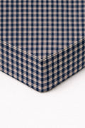 Blue plaid fitted crib sheet with elastic corner seams