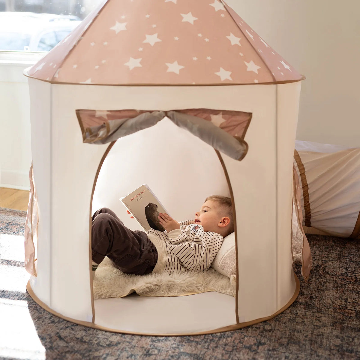 Star-roof play tent with arched window and white base fabric, light tan and cream
