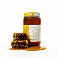 Raw honey jar with honeycomb and orange blossom label, 16 oz