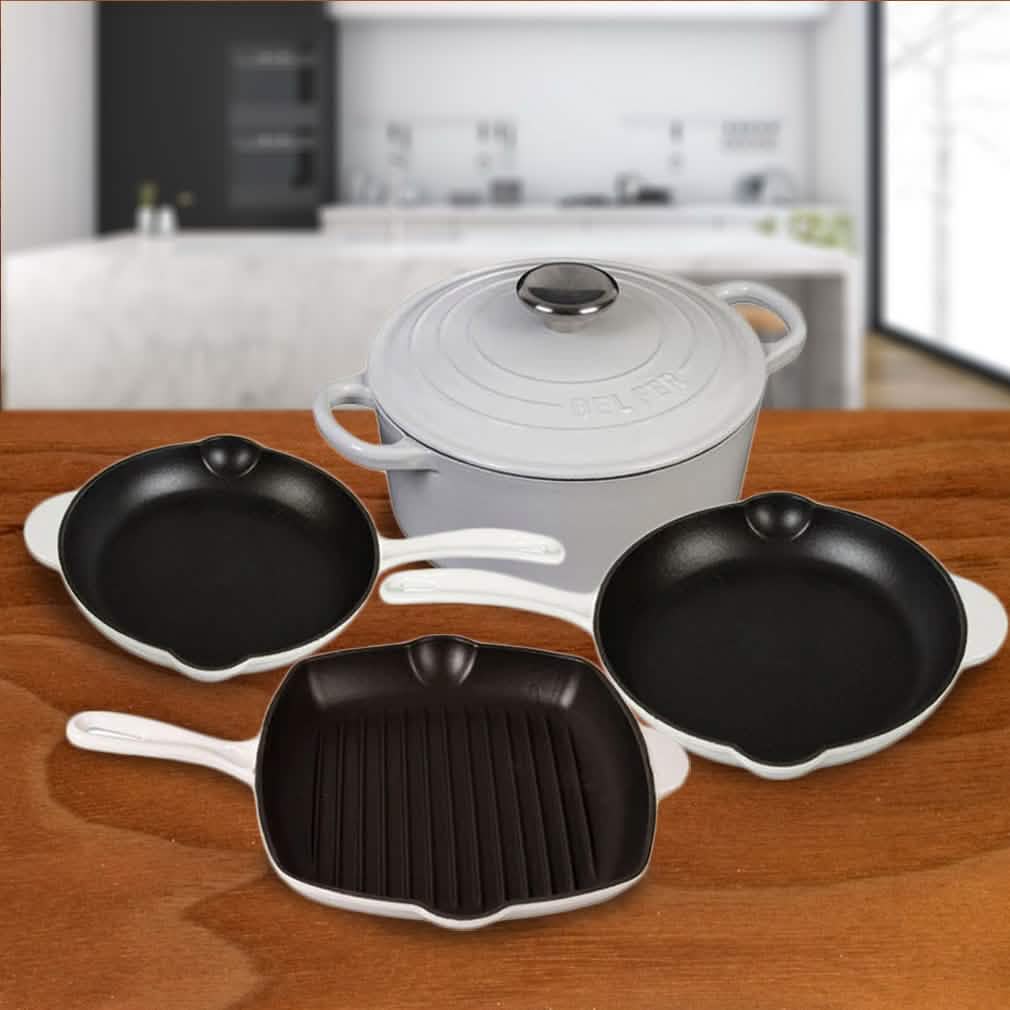 5-piece enameled cast iron cookware set with white lids and black cooking surfaces