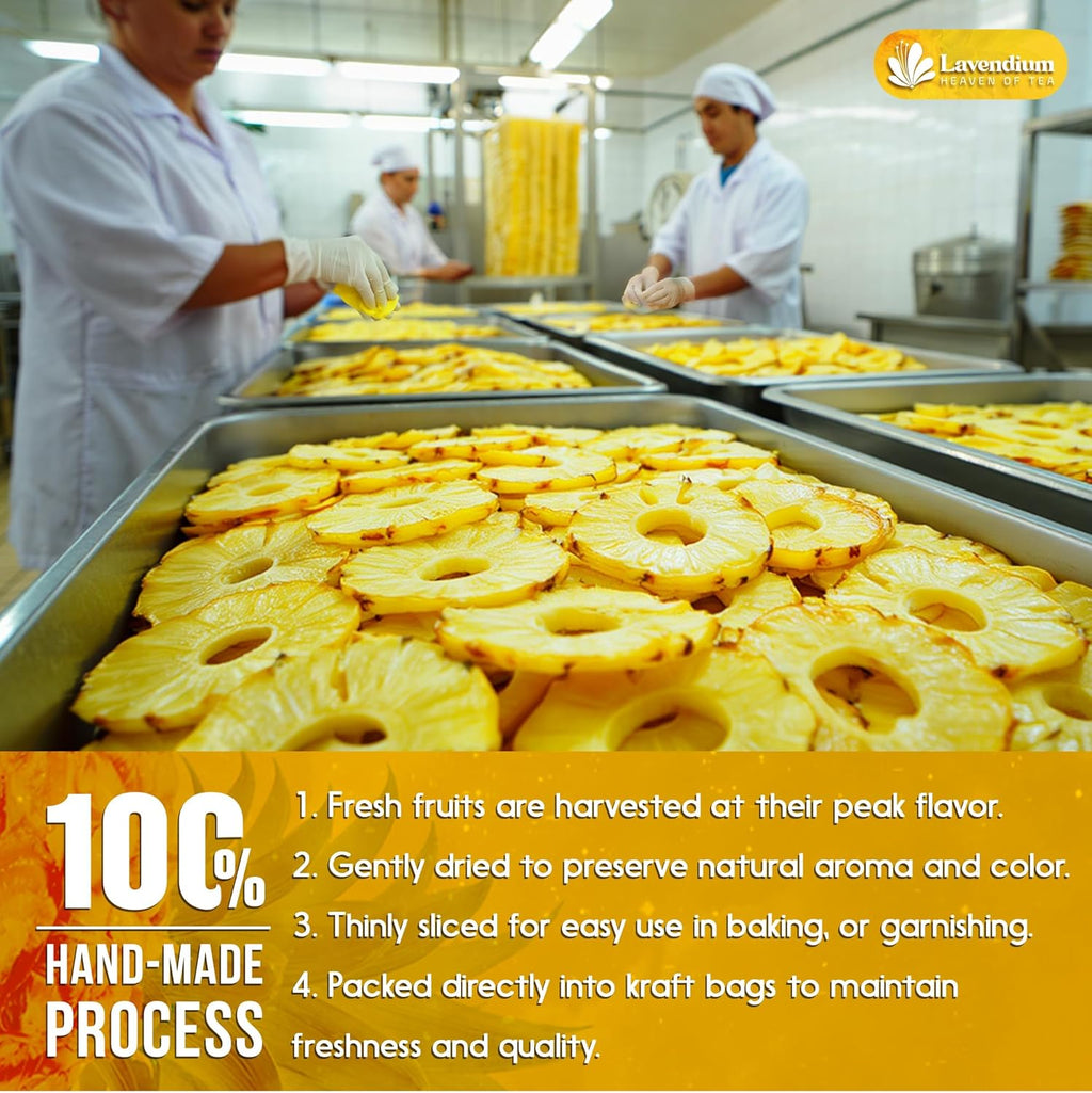 Thin dried pineapple slices laid in rows on baking trays in a facility