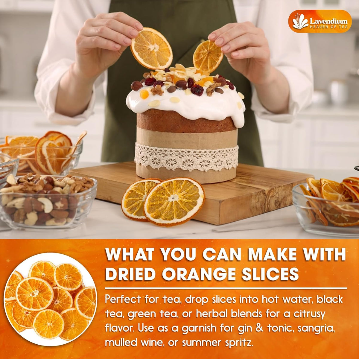 Cook holding dried orange slices over a table with baking items