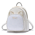 White PU leather backpack with light-blue glitter front pocket, rhinestone trim, dual zippers.