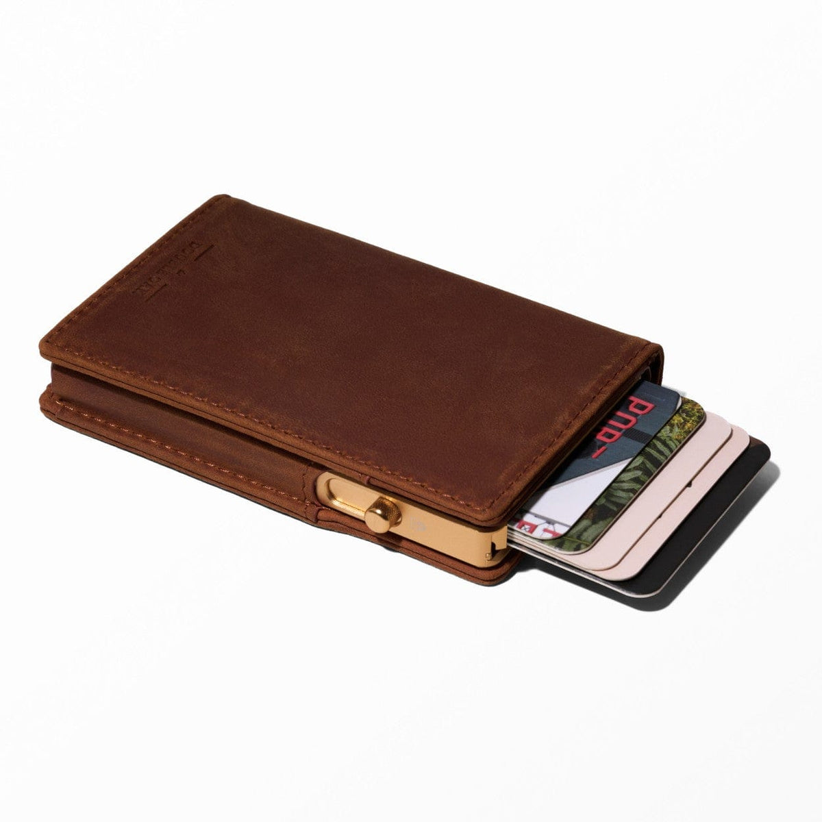 Brown leather bifold wallet with card slots and gold tone snap closure
