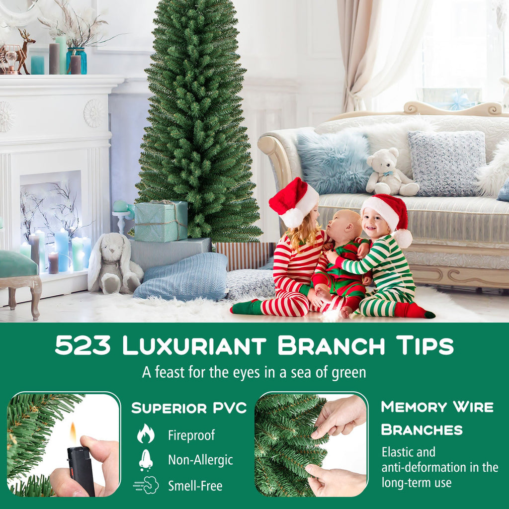 Artificial green pencil Christmas tree with dense tips and metal stand, next to sofa