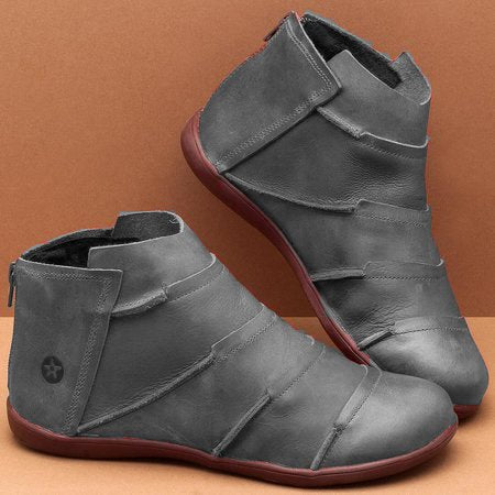 Gray short ankle boots with side pull tab and textured stitching