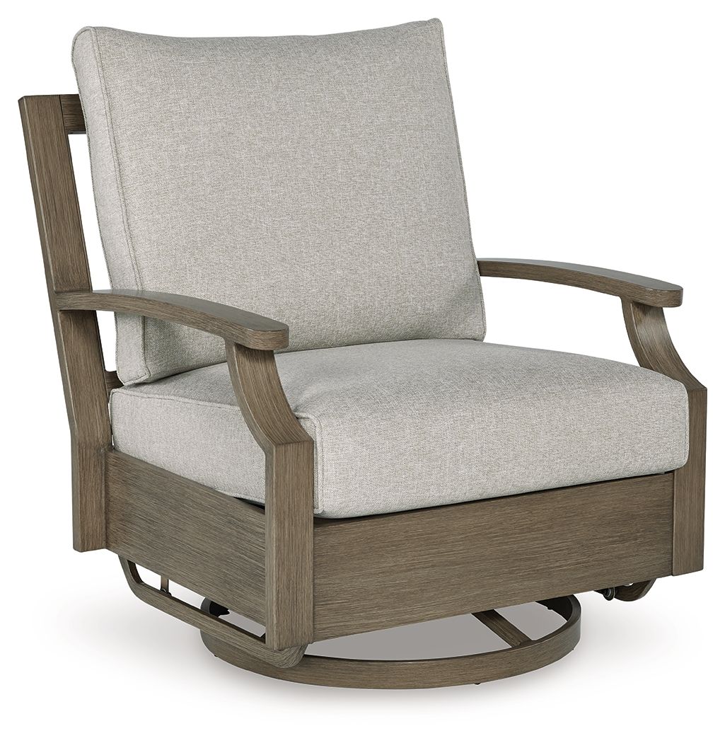 Swivel glider chair with beige cushion and brown frame, curved swivel base detail