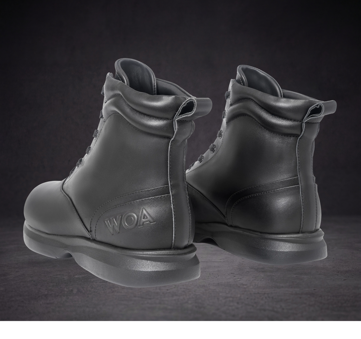 Pair of WOA lace-up ankle boots side-by-side with rear pull tabs