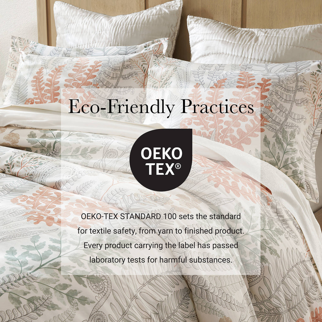 Cotton duvet cover and shams set with botanical leaf print in white, terracotta, and sage