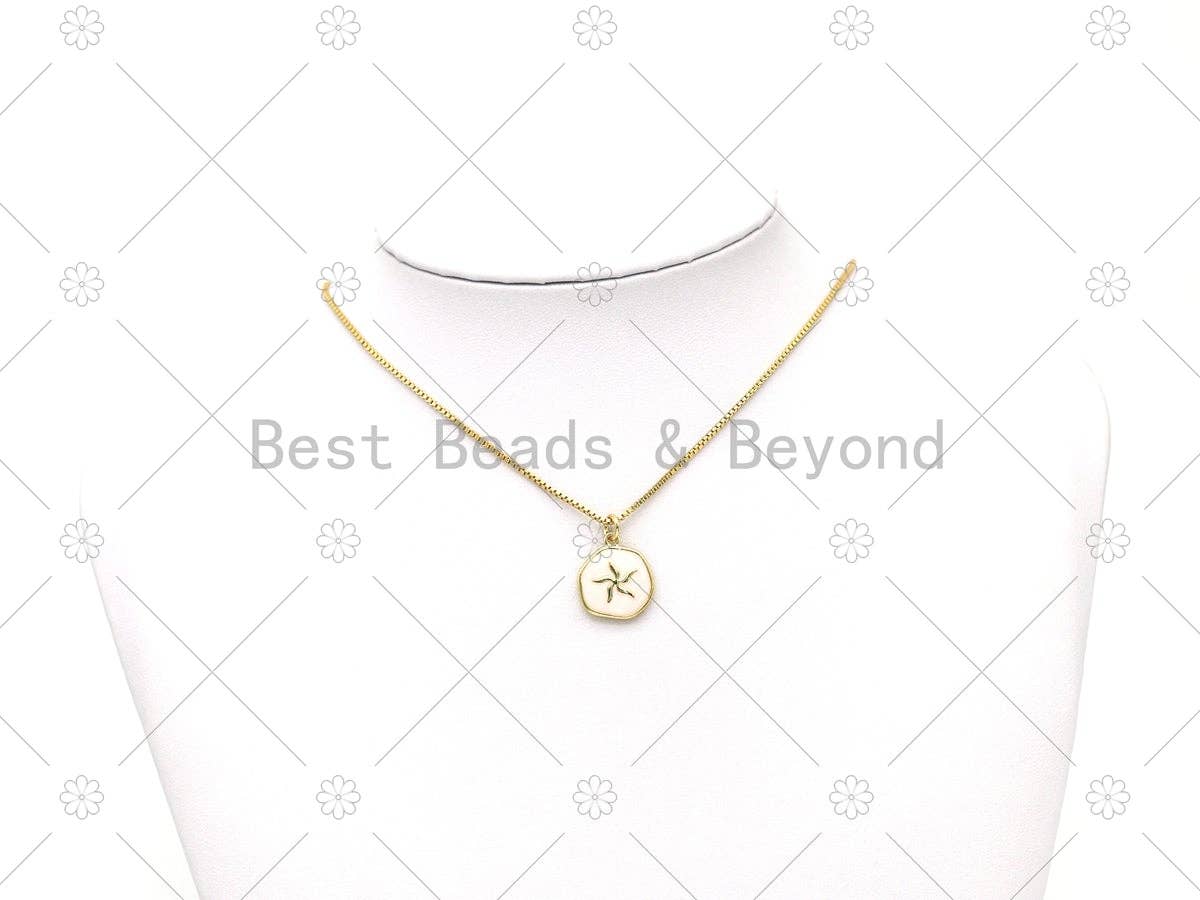 Gold-tone pendant necklace with two round enamel charms: blue seahorse and pink flower