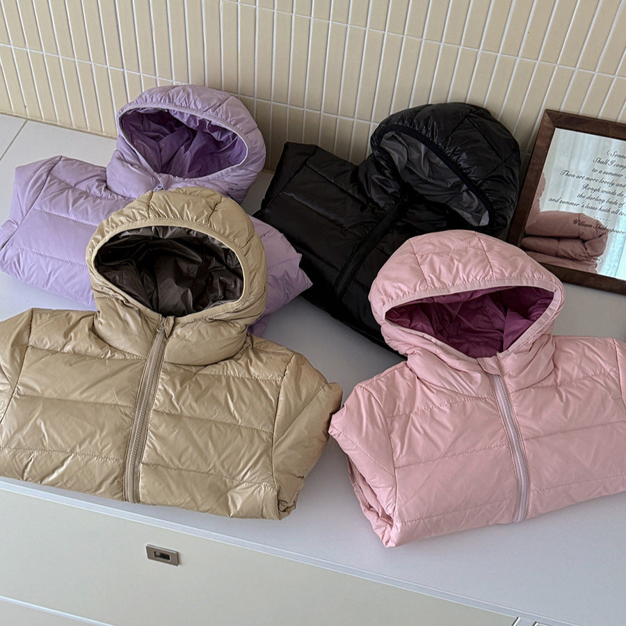 Kids' hooded puffer jackets on shelf: beige, black, purple, and pink