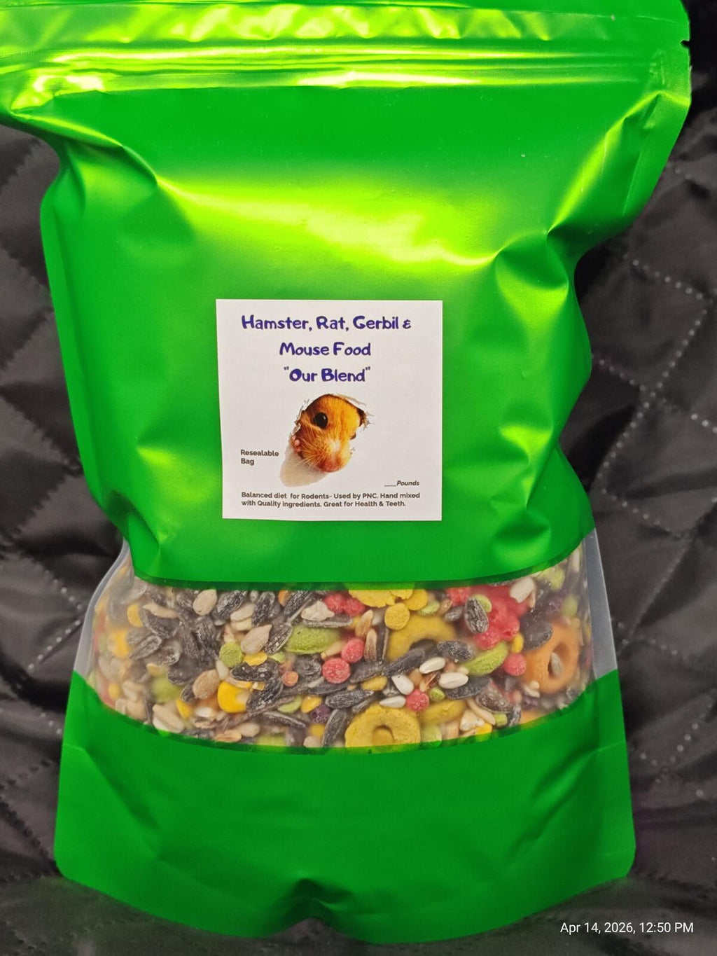 Green rodent food pouch with label and clear view of mixed kibble through pouch.