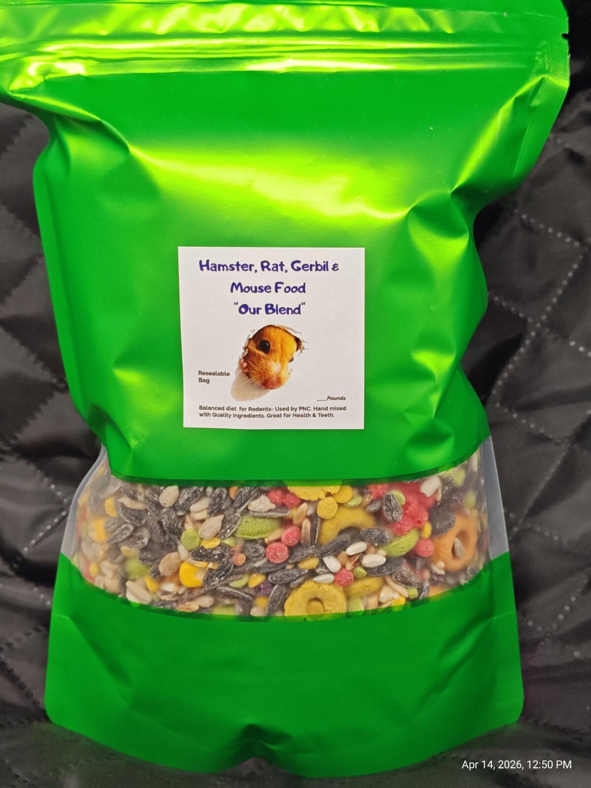 Green rodent food pouch with label and clear view of mixed kibble through pouch.