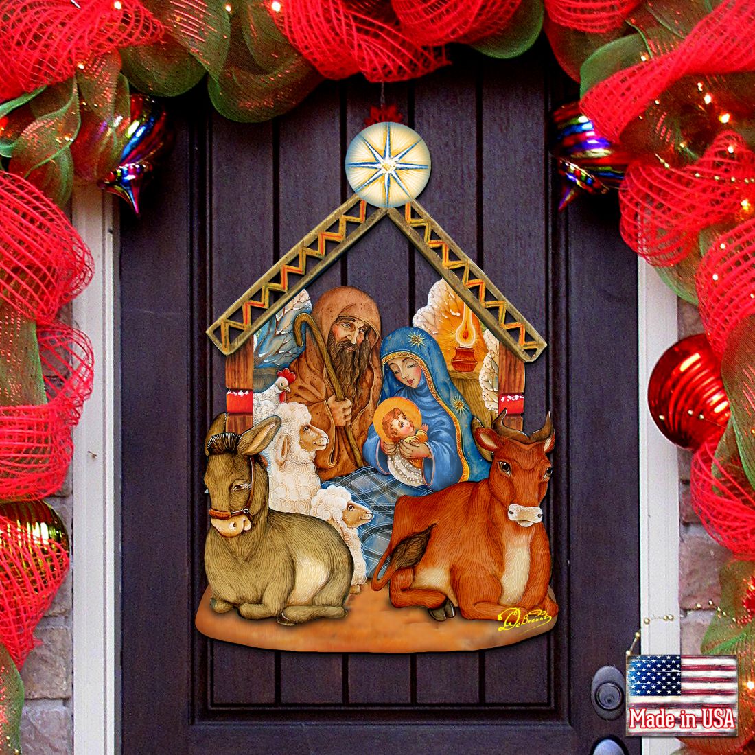 Nativity wooden door decor with barn scene, donkey, Mary, Joseph, baby, and star topper