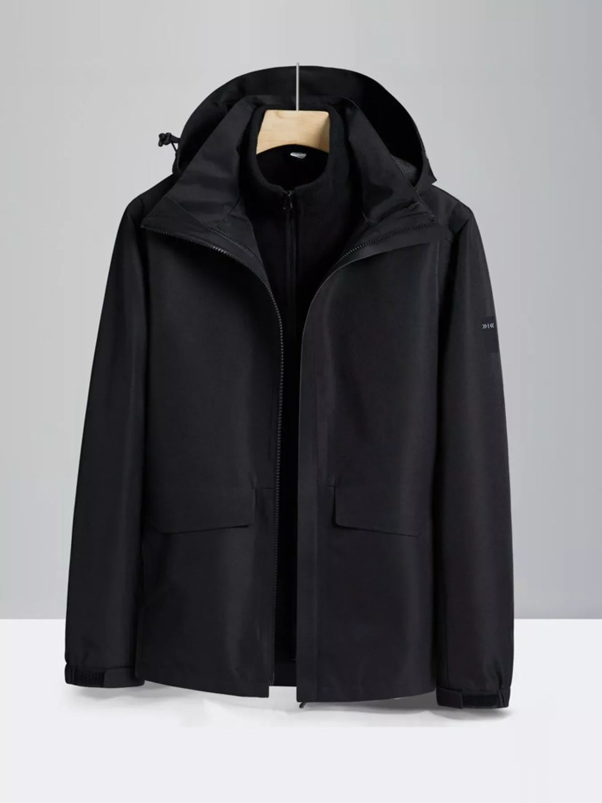 Black zip-up hooded waterproof jacket with adjustable hood