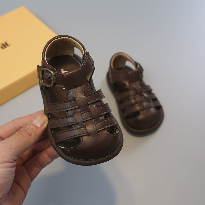 Toddler girls' brown closed-toe woven strap shoes with buckle and cutout detailing