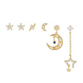 Gold celestial stacking earring set with star and crescent moon charms plus zirconia details.