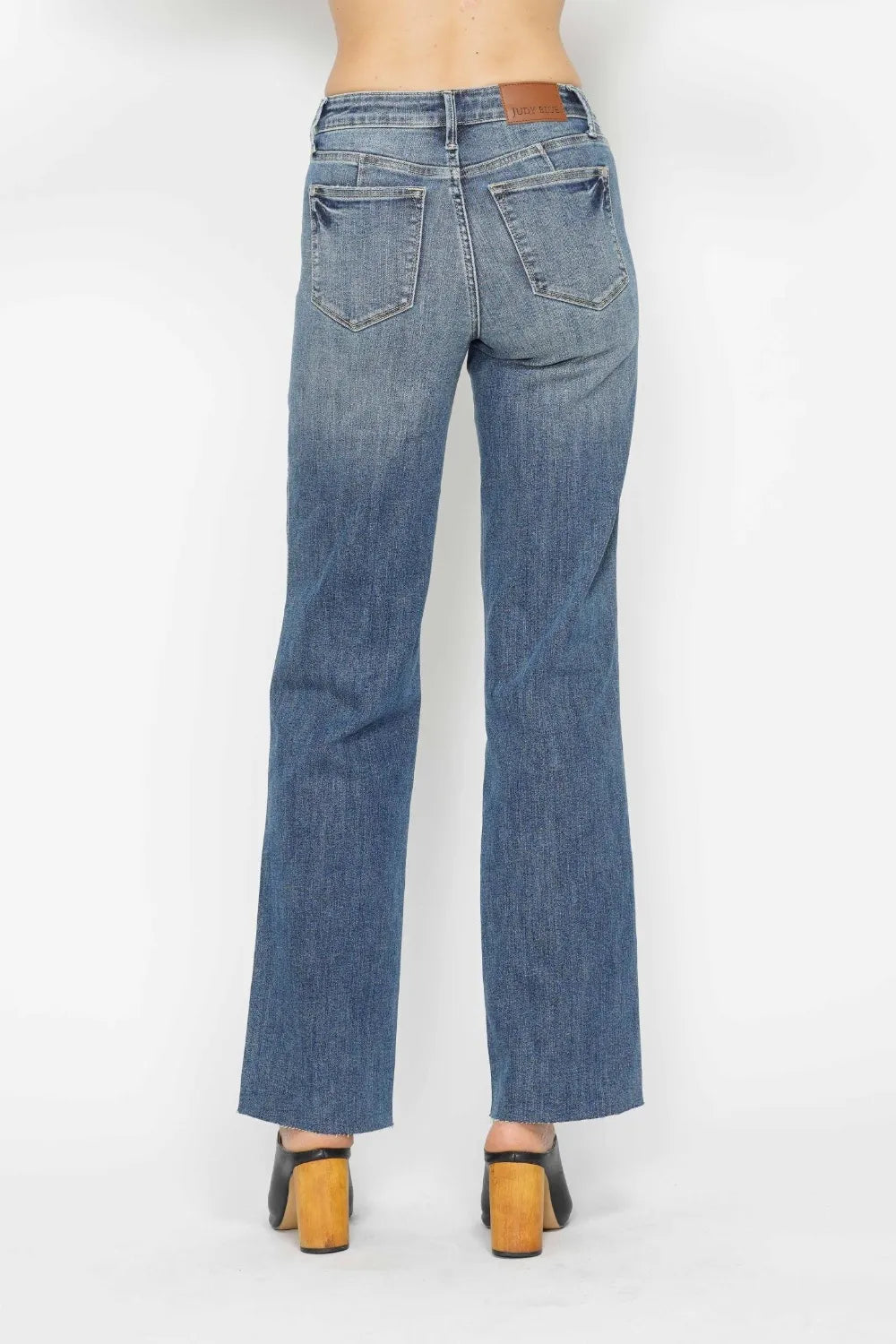 Medium-wash straight-leg jeans, back view with two patch pockets