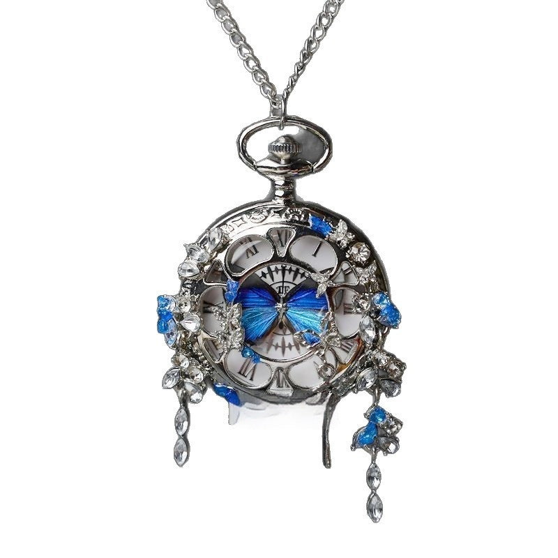 Butterfly pocket watch pendant necklace with blue butterfly centerpiece and crystal dangles